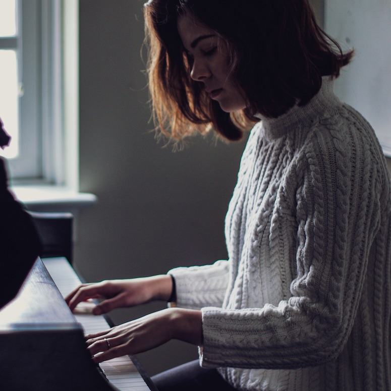 Female piano playing practicing the piano